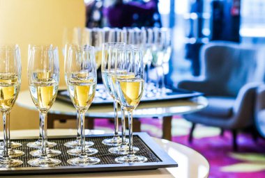 Glasses of champagne and sparkling wine served on a tray during 