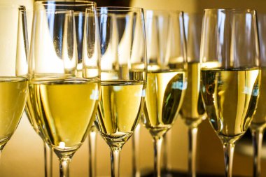 Glasses of champagne and sparkling wine served on a tray during 
