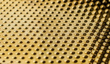 Arkaplan, malzeme ve iç tasarım konsepti olarak altın metalik yüzey dokusu