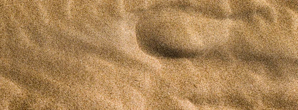 Arena en la playa en verano, textura como fondo —  Fotos de Stock