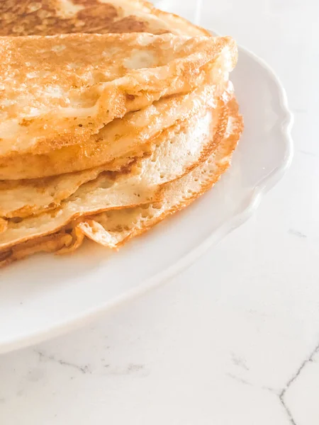 Thin homemade pancakes on table, rustic food — Stock fotografie