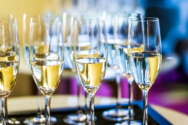 Glasses of champagne and sparkling wine served at charity event, alcoholic drinks