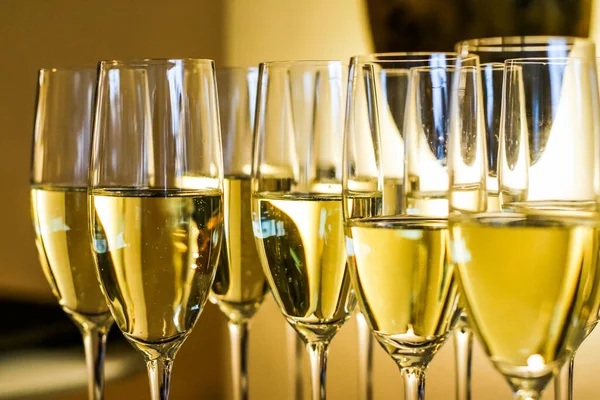 Glasses of champagne and sparkling wine served at charity event, alcoholic drinks