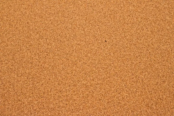 夏天沙滩上的沙子，质地为背景 — 图库照片