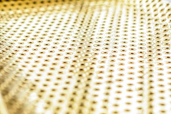 Texture of golden metallic surface as background, materials and interior design