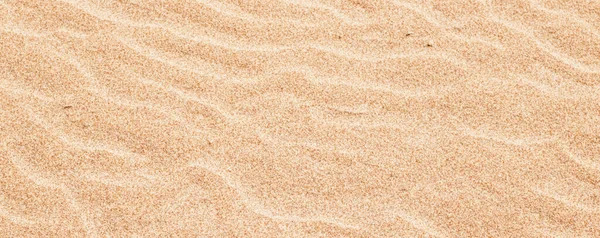 Sand on the beach in summer, texture as background — Stock Photo, Image