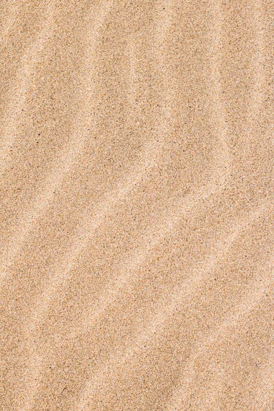 Песок на пляже летом, текстура в качестве фона — стоковое фото