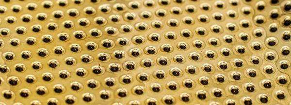 Texture of golden metallic surface as background, materials and interior design