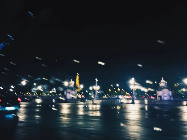 Abstract night city scene in Paris, França, motion blurred lights — Fotografia de Stock