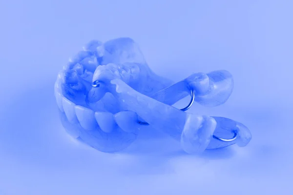 Acrylic denture with metal clasps — Stock Photo, Image