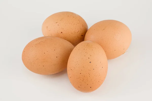 Four fresh rustic eggs — Stock Photo, Image