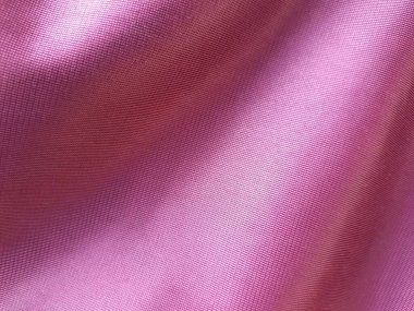 Kırmızı renkli ipeksi kumaş dokusu. Kumaş arkaplan resmi üzerindeki dalgalar