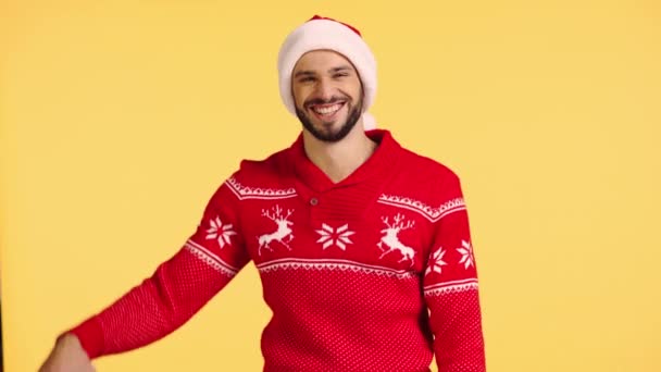 Smiling Man Holding Gift Box Isolated Yellow — Stock Video