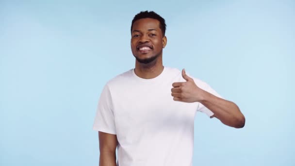 Happy African American Man Showing Thumb Isolated Blue — Stock Video