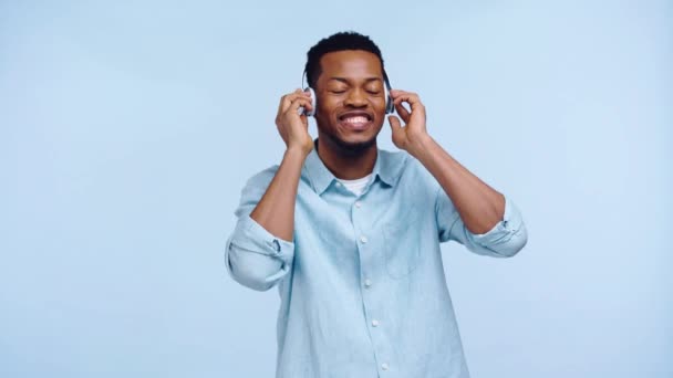 African American Man Headphones Dancing Isolated Blue — Stock Video