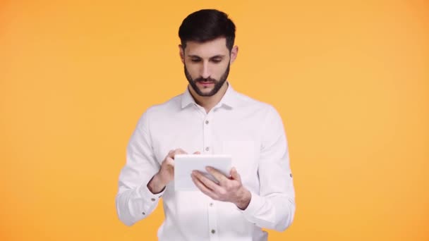 Man Holding Digital Tablet Green Screen Isolated Orange — Stock Video