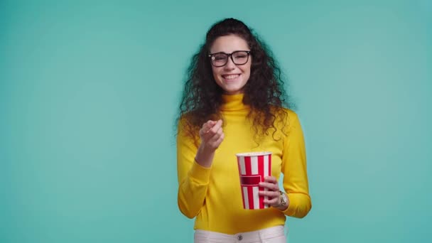 Smiling Woman Watching Movie Isolated Turquoise — Stock Video