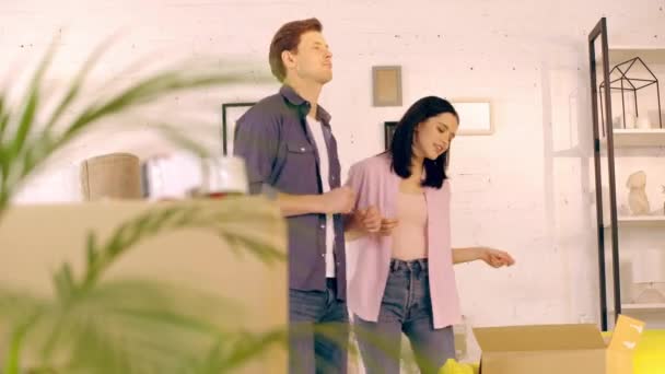 Young Couple Dancing Packages New Home — 图库视频影像