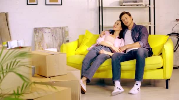 Smiling Couple Talking Couch Packages New Home — 图库视频影像
