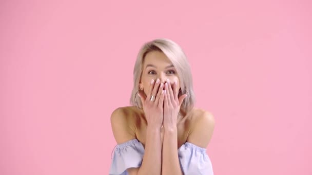 Excited Girl Covering Mouth Showing Winner Gesture Isolated Pink — Stock Video