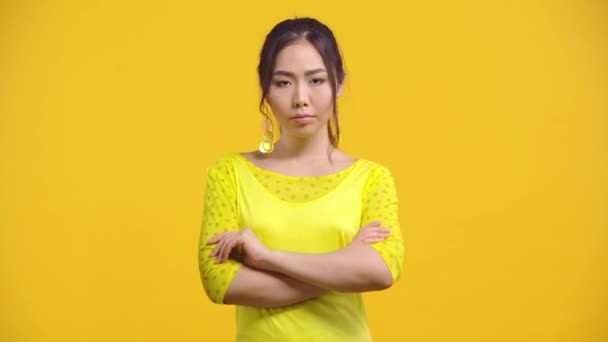 Displeased Asian Woman Crossed Arms Isolated Yellow — Stock Video