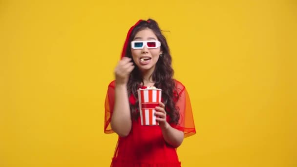 Happy Asian Girl Glasses Eating Popcorn Isolated Yellow — Stock Video