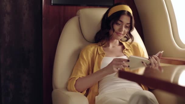 Stylish Smiling Woman Reading Book While Traveling Plane — Stock Video