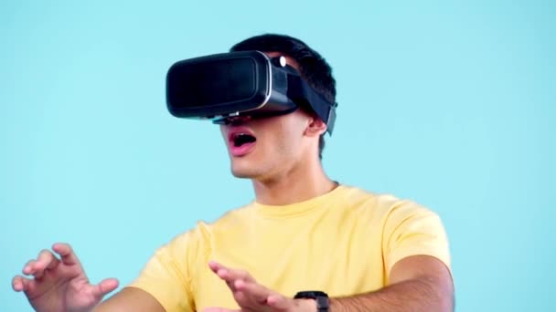 Excited Man Gesturing While Using Headset Isolated Blue — Stock Video