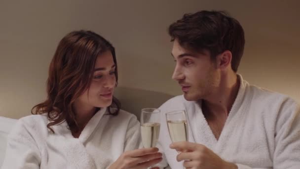 Happy Couple Bathrobes Clinking Glasses Champagne Hotel Room — Stock Video