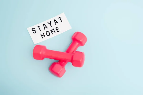 Top View Pink Dumbbells Paper Stay Home Lettering Blue Copy — Stock Photo, Image