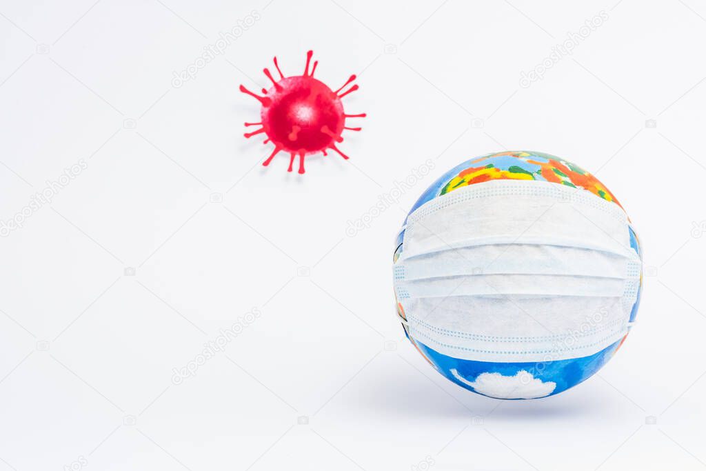 globe in protective medical mask near drawn virus on white 