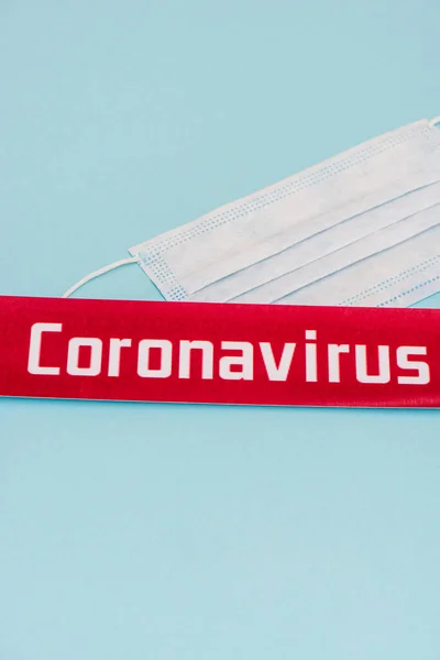 High Angle View Medical Mask Card Coronavirus Lettering Blue Background — Stock Photo, Image