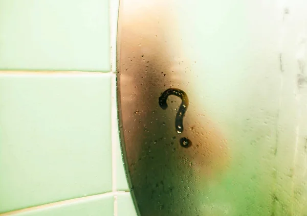 Question Mark Symbol On Misty Mirror With Water Droplets