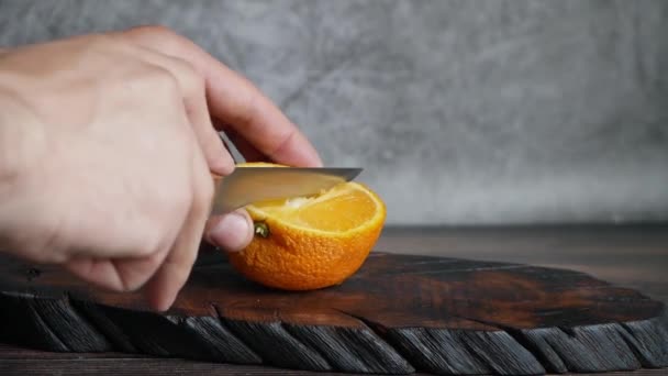 Men Hands Cut Ripe Orange Kousky — Stock video