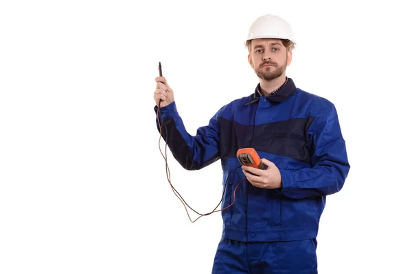 Inženýr v helmě a uniformu s tester — Stock fotografie