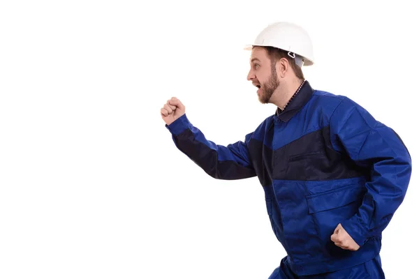 Homem construtor em chapéu duro e macacão corre para a construção isolada no fundo branco — Fotografia de Stock