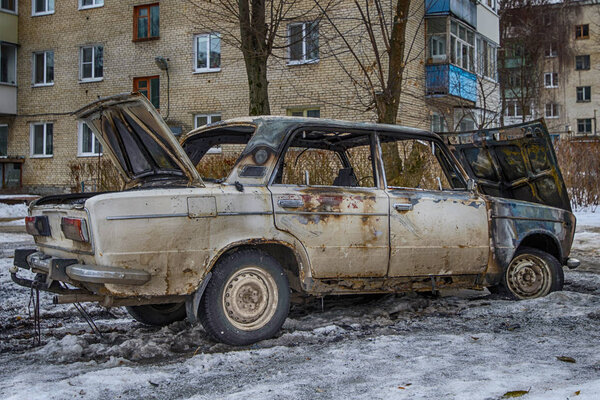 burnt out car near the apartment building. hdr Photo