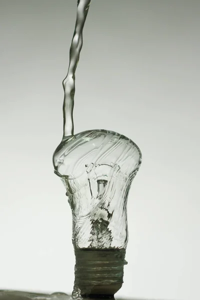 Light bulb made of water splashes — Stock Photo, Image