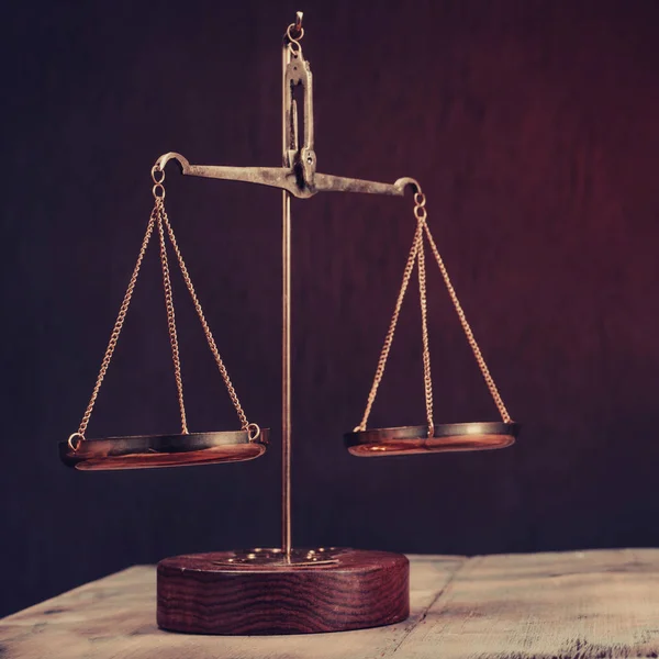 Law scales on table. Symbol of justice