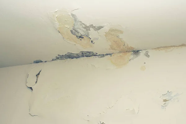 Damage ceiling from water pipelines leakage. Housing problem concept