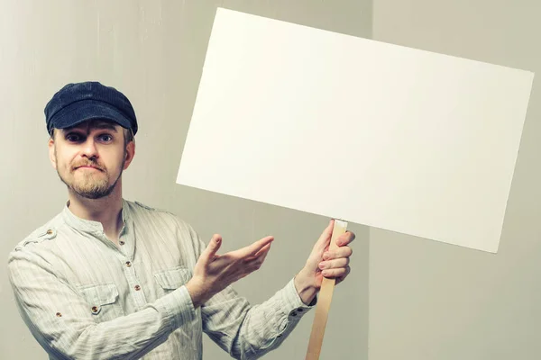 Angry protesting worker with blank protest sign.