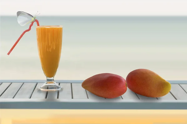 Still life with butterfly and mango juice and mango fruit