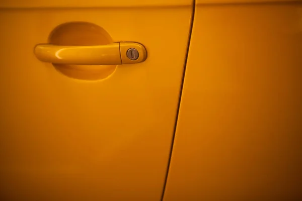 Yellow car door handle — Stock Photo, Image