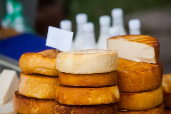 Pile of home made round cheese — Stock Photo, Image