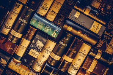 Bucharest Romania - January 27, 2020: Various whisky bottle packages of are displayed in bar in Bucharest, Romania.