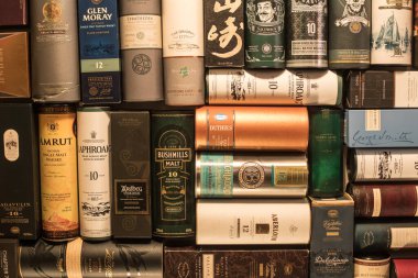 Bucharest Romania - January 27, 2020: Various whisky bottle packages of are displayed in bar in Bucharest, Romania.