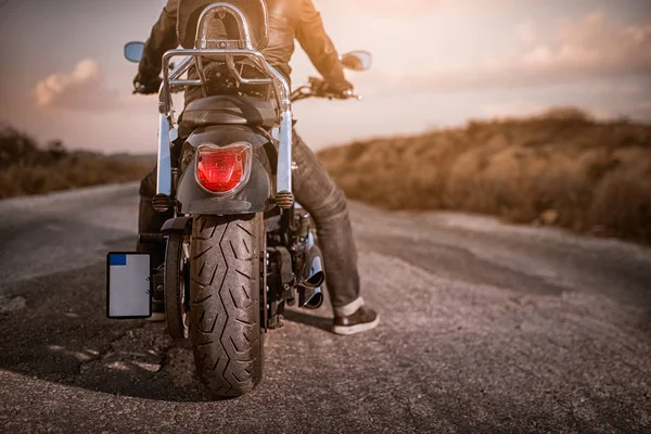 Motorbike on road with rider — Stock Photo, Image