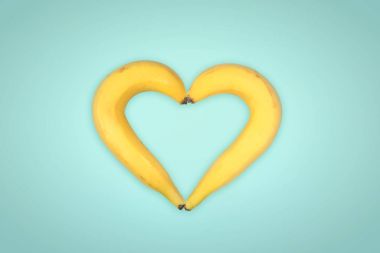 Heart Shaped two bananas on white background clipart