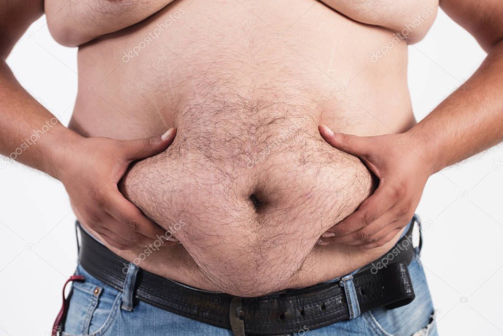 Man holding his big fat belly isolated on white background