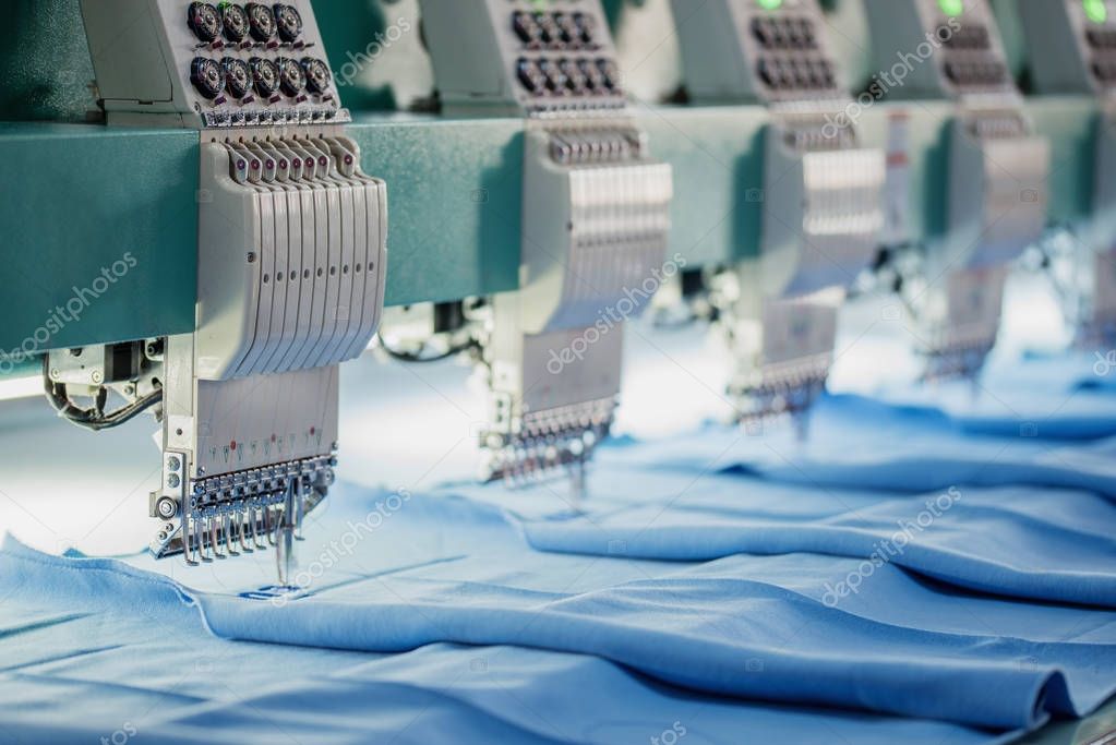 Industrial Embroidery Machine.Textile industry concpet via technology